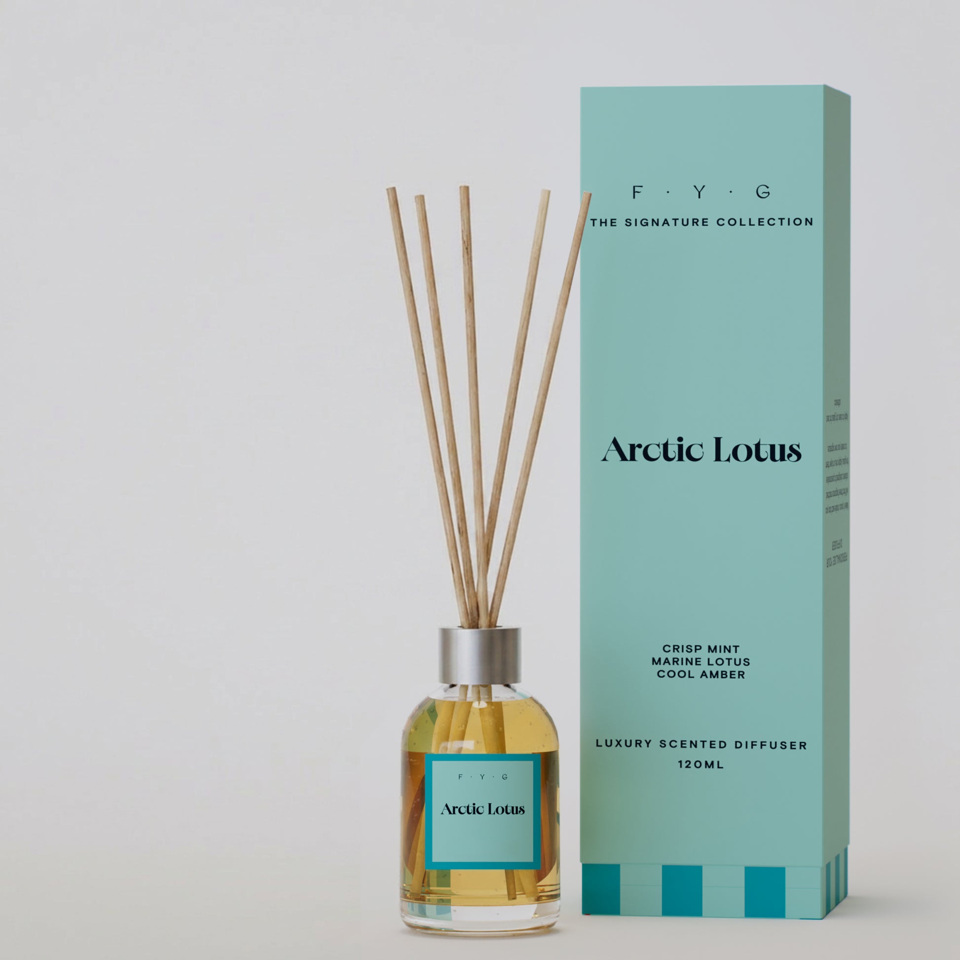 Arctic Lotus reed diffuser with reeds and aqua Signature Collection gift box