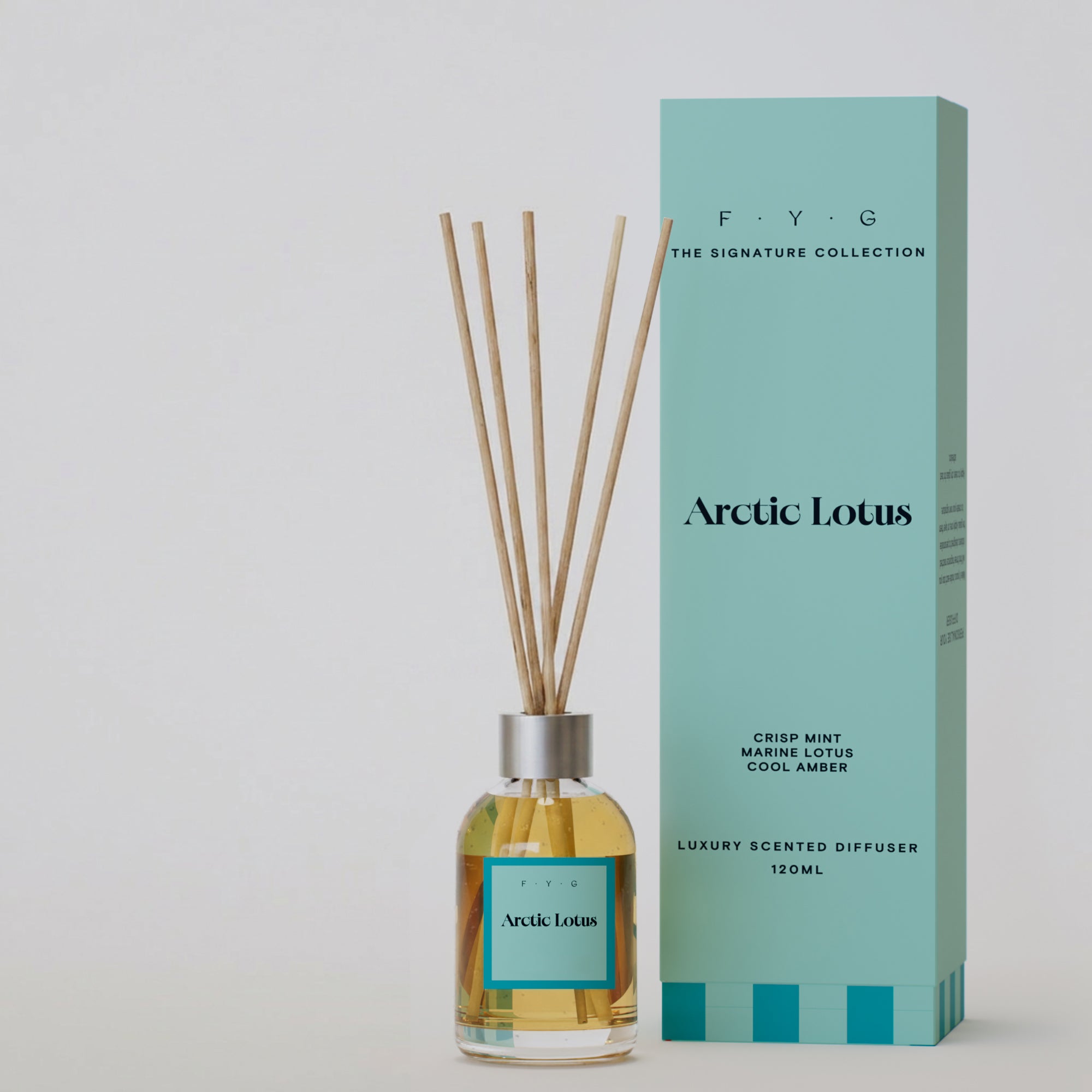 Arctic Lotus reed diffuser with reeds and aqua Signature Collection gift box