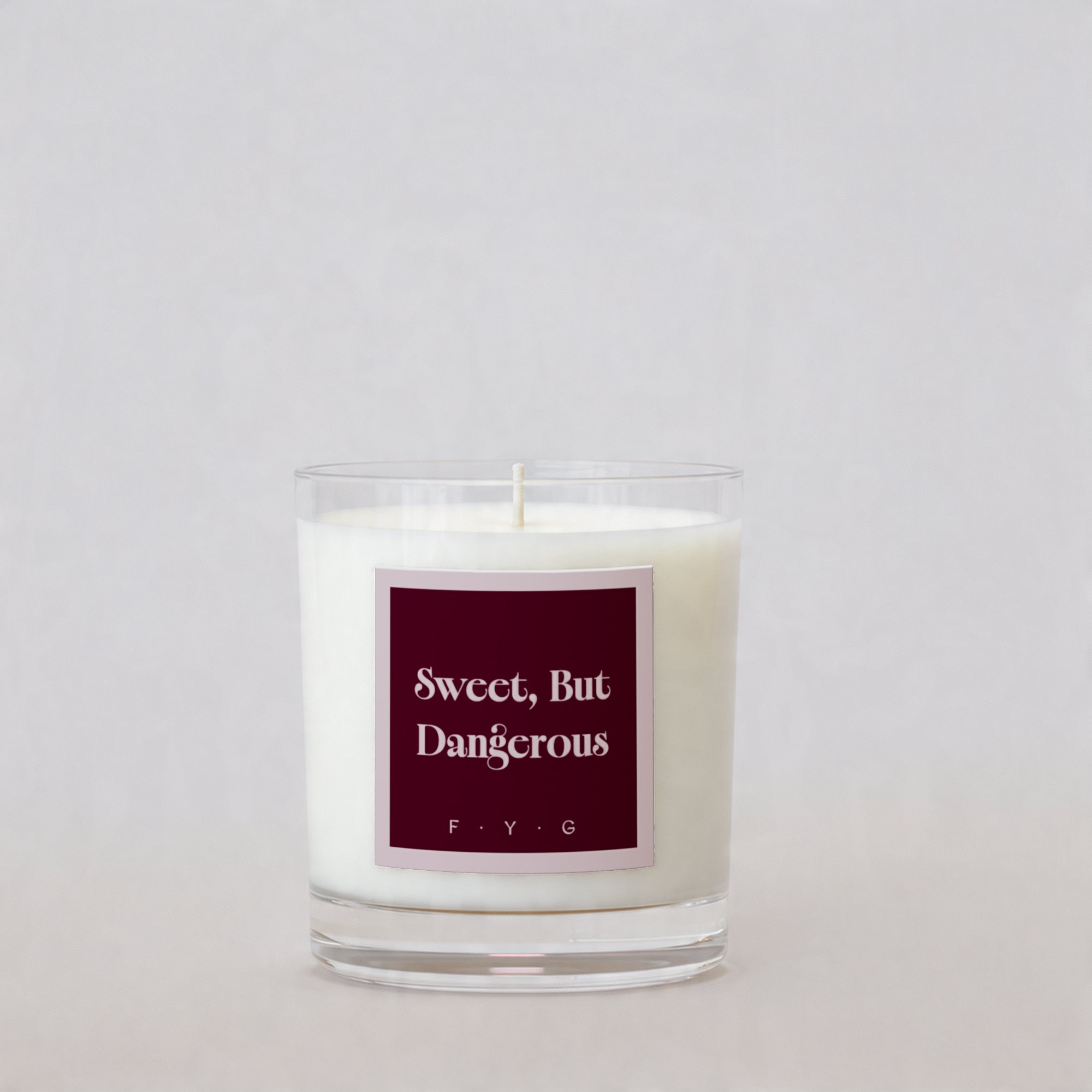 Rouge Lychee candle with Sweet But Dangerous Signature Mark label
