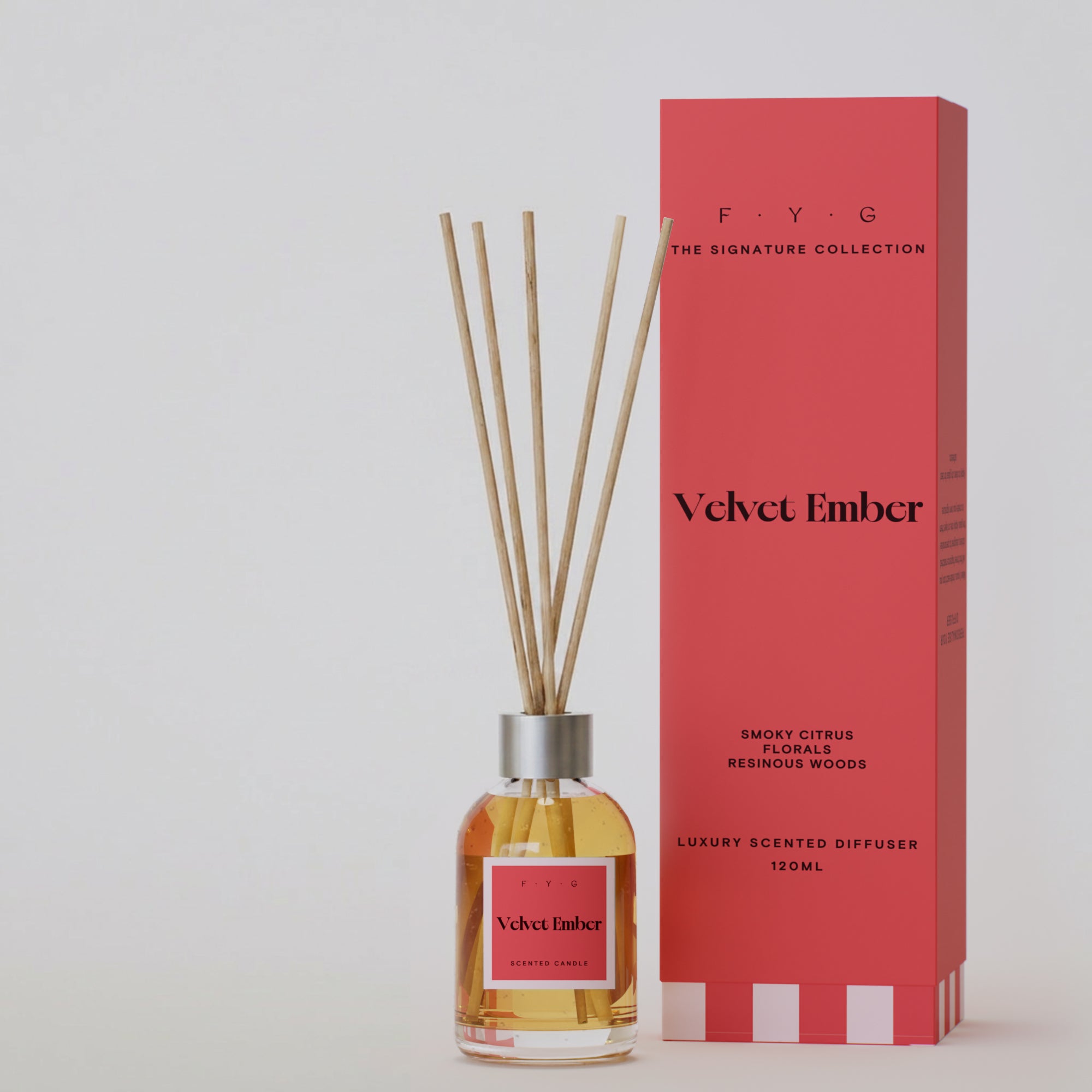 Velvet Ember reed diffuser with reeds and coral Signature Collection gift box