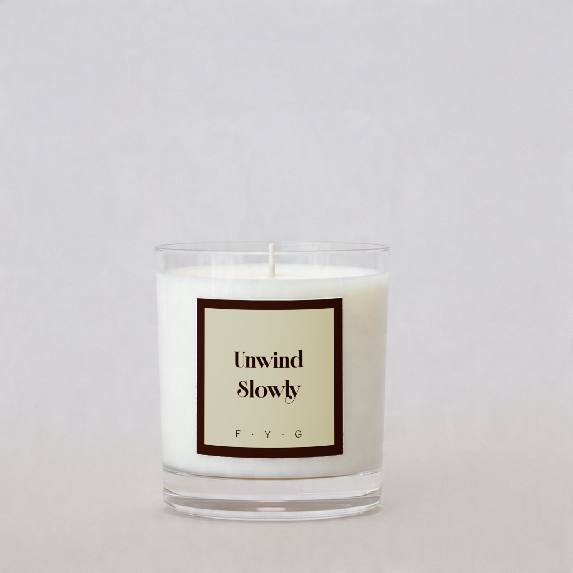 Chestnut Cashmere candle with Unwind Slowly Signature Mark label