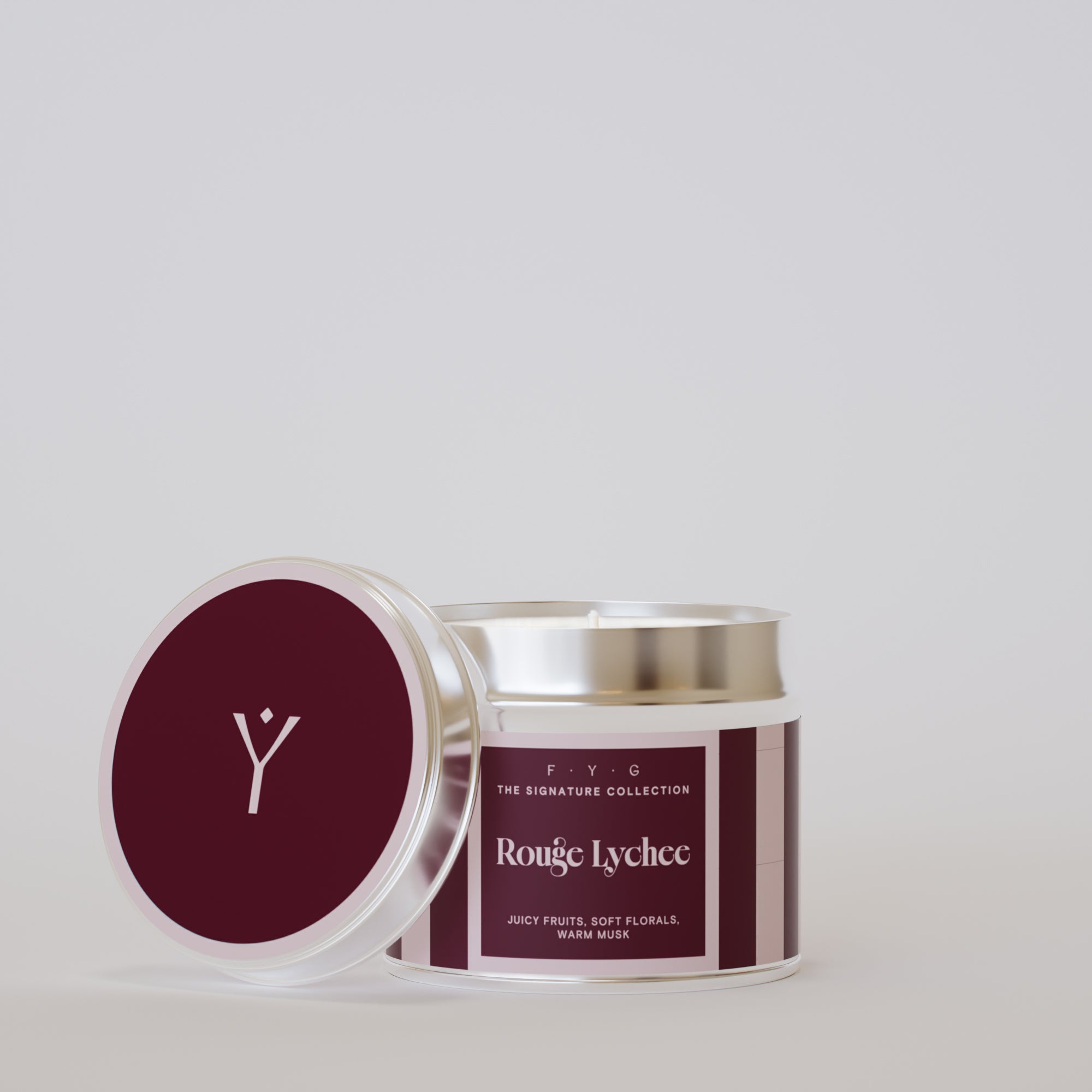 Rouge Lychee 175g tin candle open with silver lid beside it