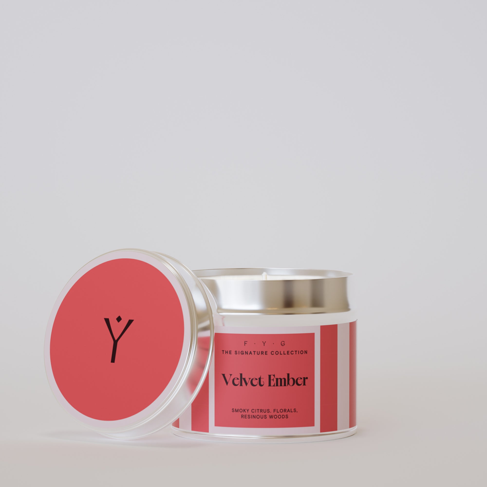 Velvet Ember 175g tin candle open with silver lid beside it